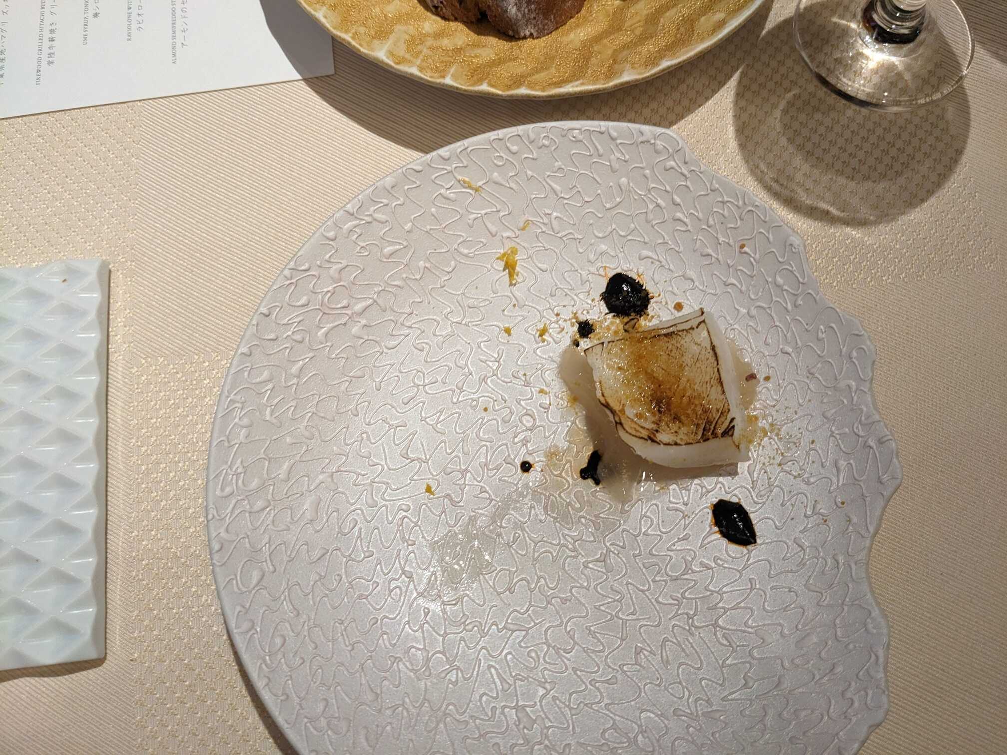 Broiled Chinese ink covered cuttlefish with seasonal onion and scent of yuzu